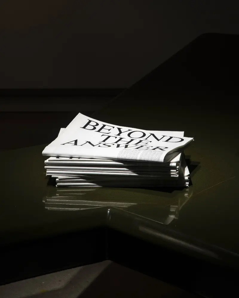 Beyond the Answer Newspaper on bench